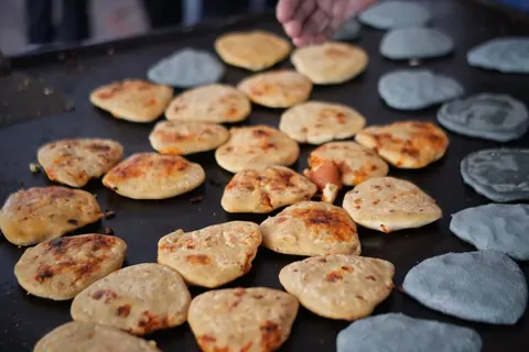 Freshly made tlacoyos at the market