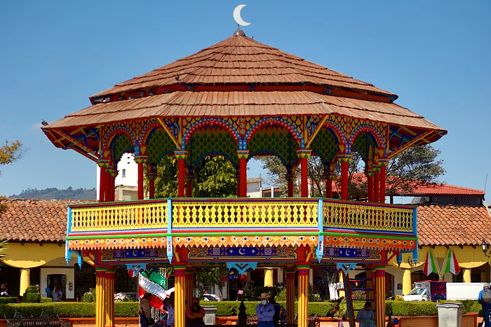 The kiosk in the main square of Chignahuapan by day, under a blue sky